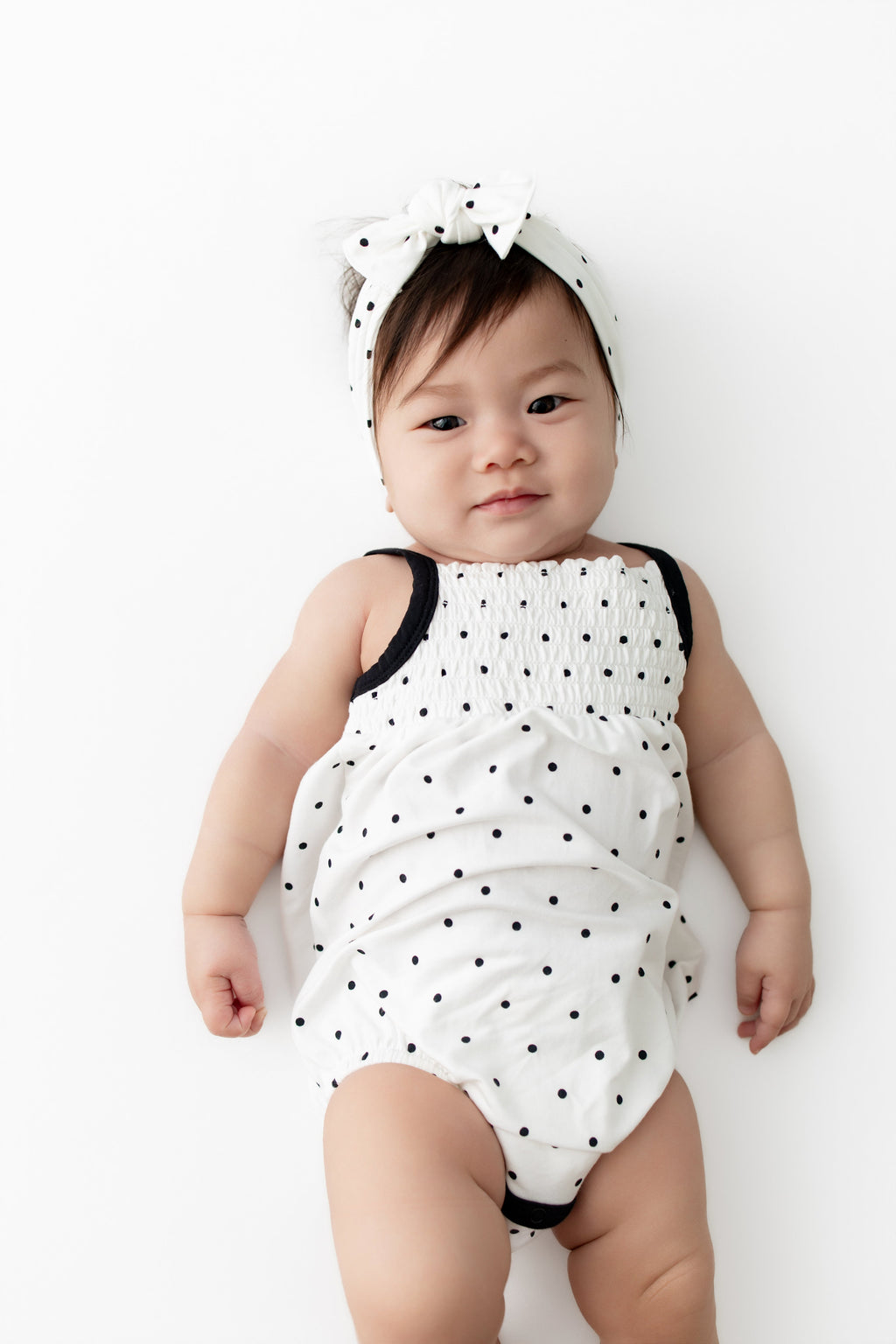 Smocked Bubble Romper in Midnight Polka Dot