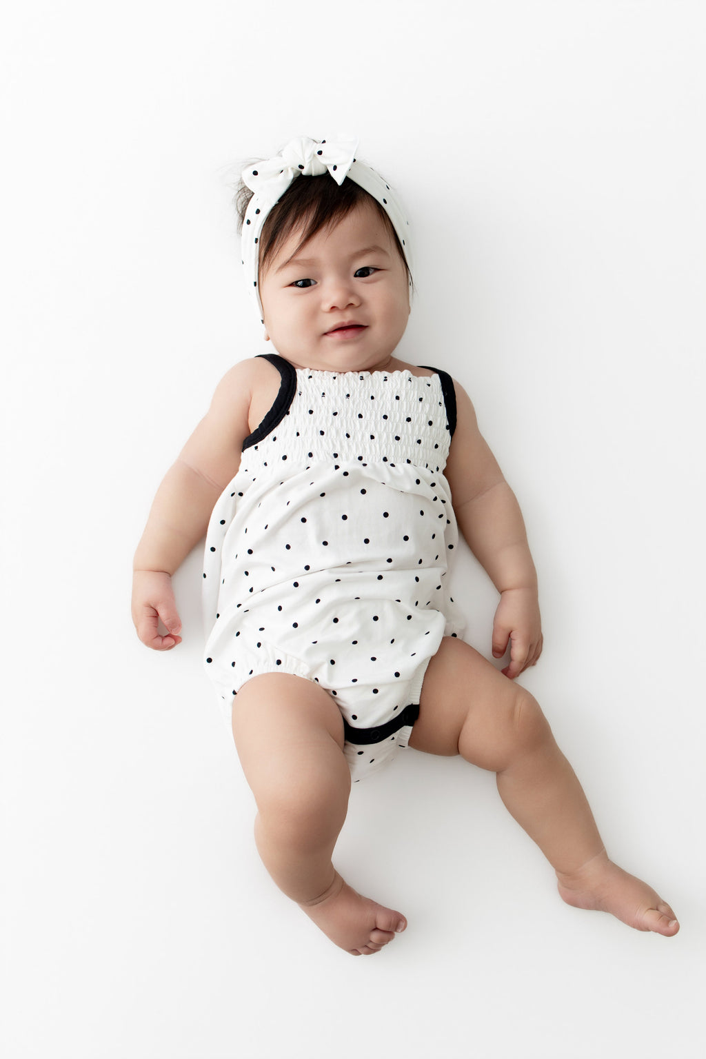 Smocked Bubble Romper in Midnight Polka Dot
